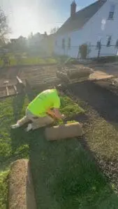 Doskoch Lawn Care & Landscaping Services crew member installing a new yard