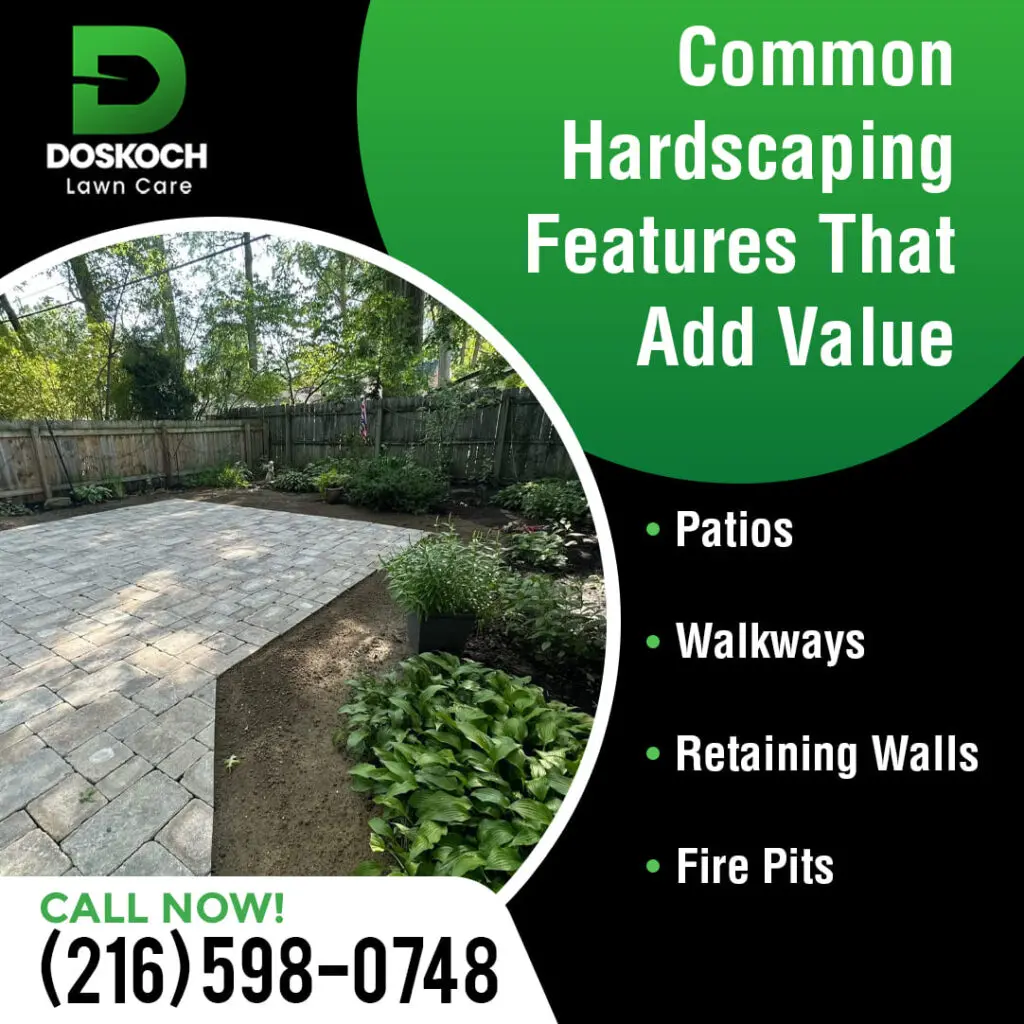 A newly installed stone patio in a backyard surrounded by fresh landscaping