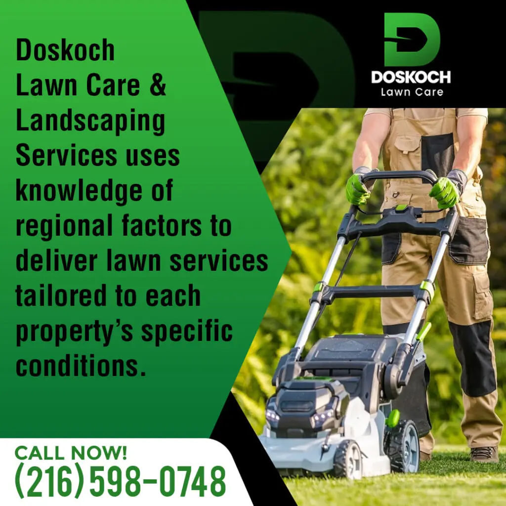 A person in work overalls and gloves operating a green and black lawnmower on a green lawn."