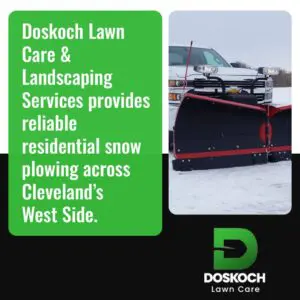 Residential snow plow truck clearing driveway in Cleveland West Side neighborhood