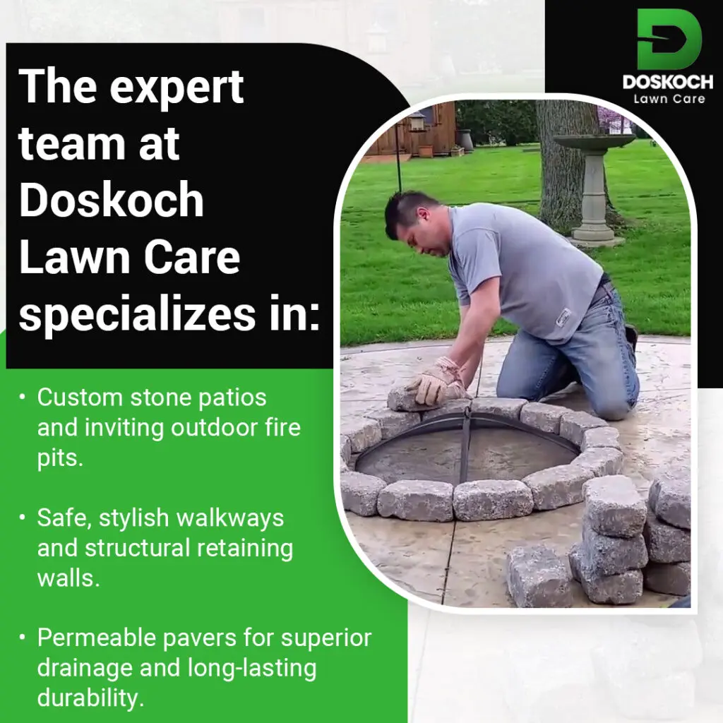 Contractor installing a custom stone fire pit patio as part of residential hardscaping project