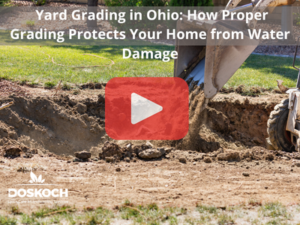 Yard grading.Red play buttom overlay and Doskoch logo. Words: Yard Grading in Ohio: How Proper Grading Protects Your Home from Water Damage