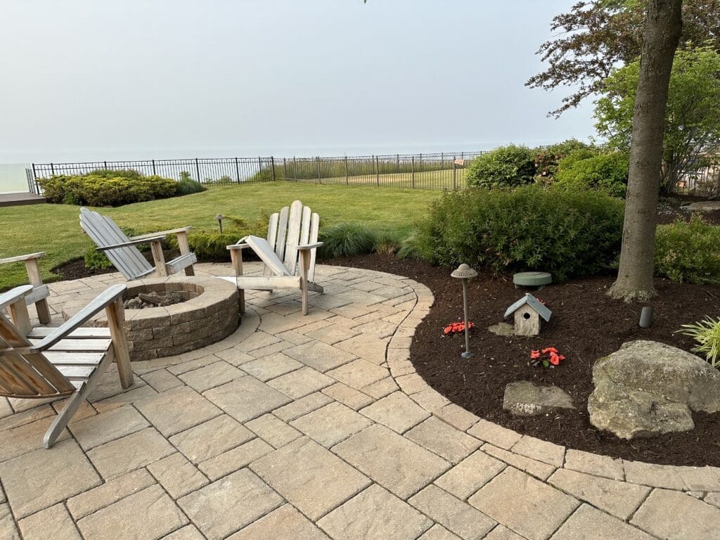 Lake Erie backyard with custom fire pit and paver patio
