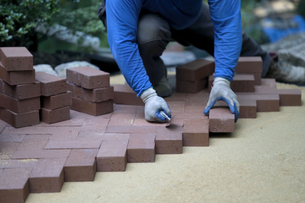 Landscaper organizing rhe stones.